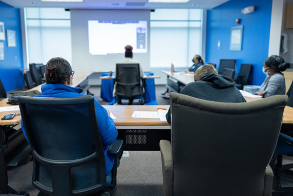 A group of people in a room.