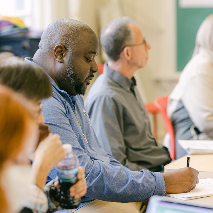 A person taking notes.