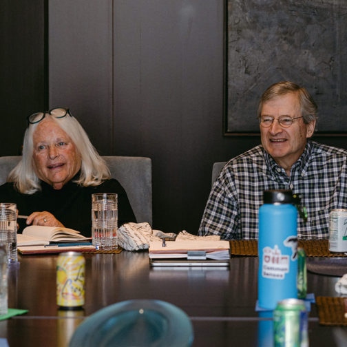 Barbara Weitz and Wally Weitz seated at table.